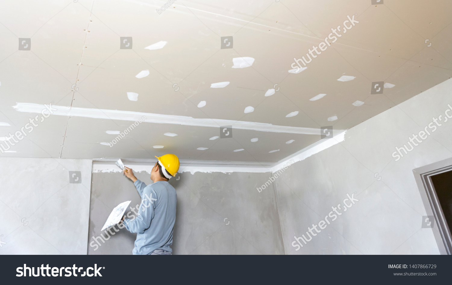 Craftsman working on gypsum ceiling installation